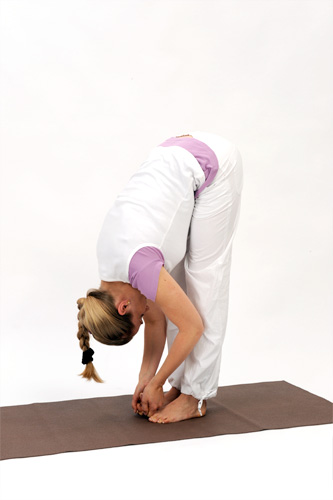 <b>STANDING FORWARD BEND (PADA HASTHASANA)</b> – Similar benefits like Forward Bend. The spine becomes supple and is lenghtened. The joints are mobilised and perennial youth is established. The hamstrings and other muscles on the back of the legs are stretched. There is an increase of blood supply to the brain.